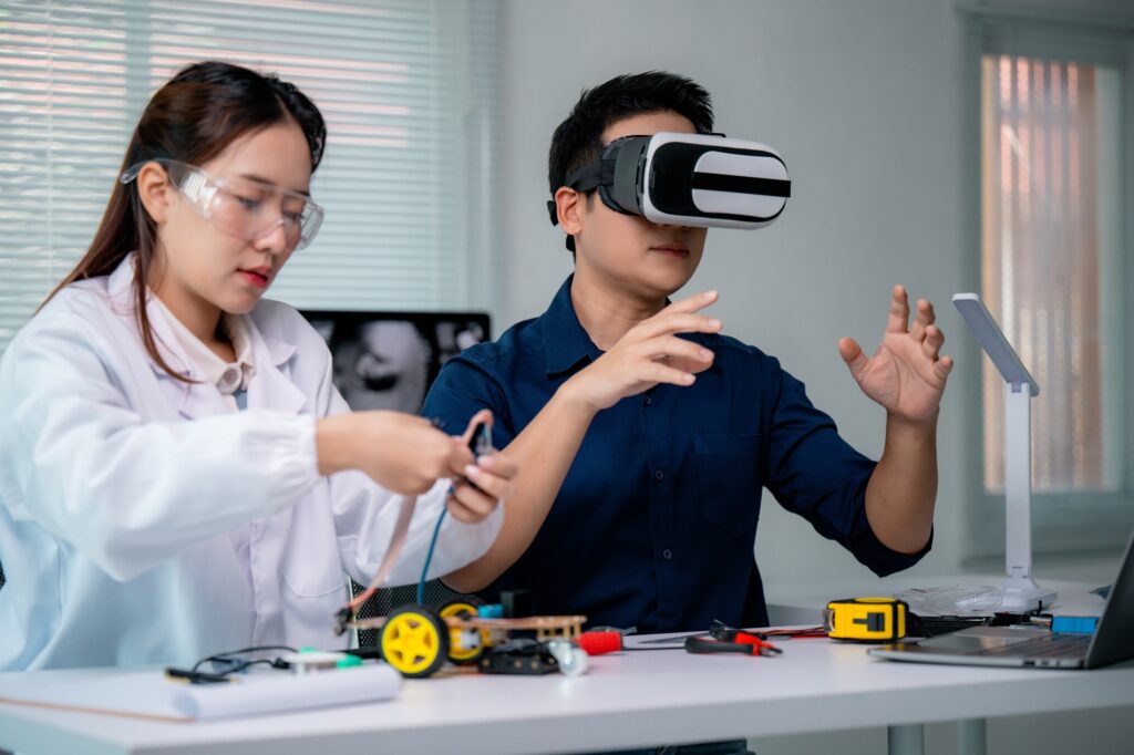 Engineers developing innovative robotics project using virtual reality headset