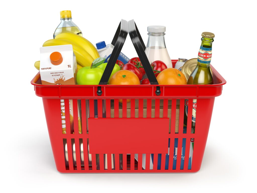 Shopping market basket with variety of grocery products isolate
